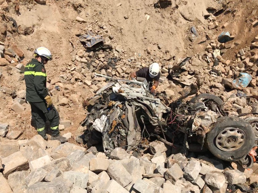 Lebanese civil defense workers search for the bodies of those killed in the explosion at Beirut's port.