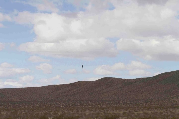 In this Saturday afternoon, Feb. 22, 2020, photo “Mad” Mike Hughes rocket plunges back to earth near Barstow, Calif.