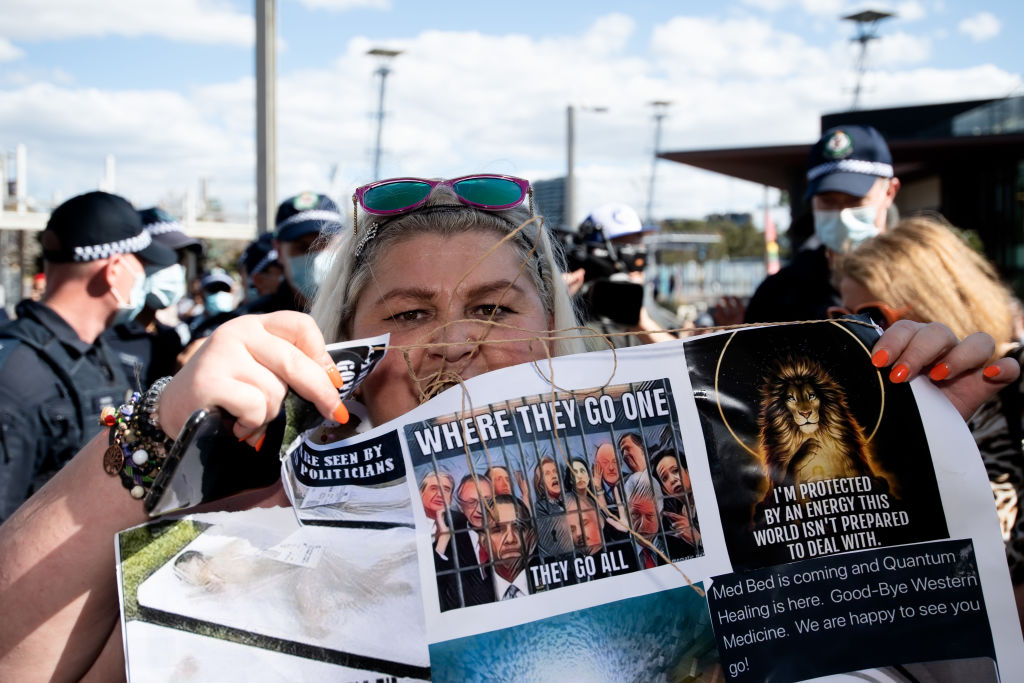 A protester holds a sign up during the Freedom Day Rally in Sydney on Sept. 5, 2020.