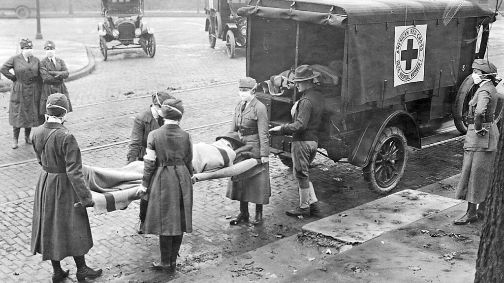 Members of the American Red Cross remove Spanish influenza victims from a house at Etzel and Page avenues in 1918. (St. Louis Post-Dispatch file photo/Tribune News Service via Getty Images)