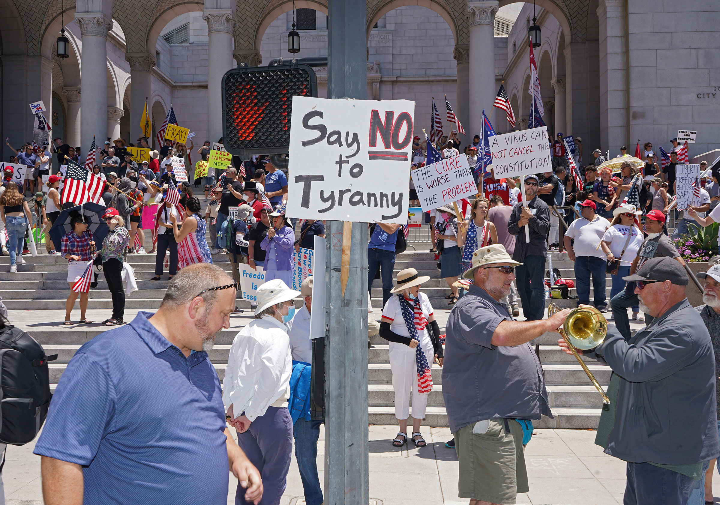 Protesters calling for a reopening of California from coronavirus lockdown measures and restrictions in front of City Hall in Los Angeles, May 24, 2020.