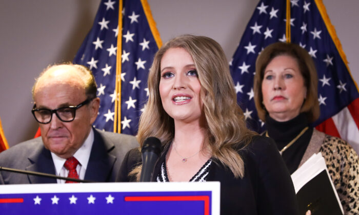 President Donald Trump campaign senior legal adviser Jenna Ellis speaks to media while flanked by Trump lawyer and former New York City Mayor Rudy Giuliani (L) and attorney Sidney Powell, at a press conference at the Republican National Committee headquarters in Washington on Nov 19, 2020. (Charlotte Cuthbertson/The Epoch Times)