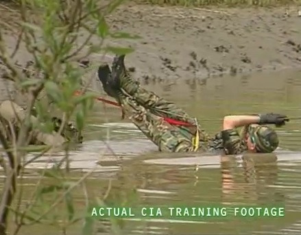 Another clip shows a man, clad in camouflage, hanging off a rope in water