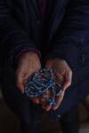 Laurie Nelsen holds a rosary made by her mother, Claire Ryan.