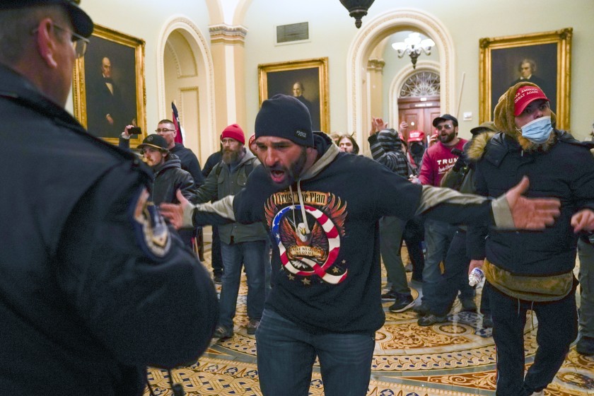 Trump supporters clash with police in the halls outside the U.S. Senate chamber on Jan. 6, 2021