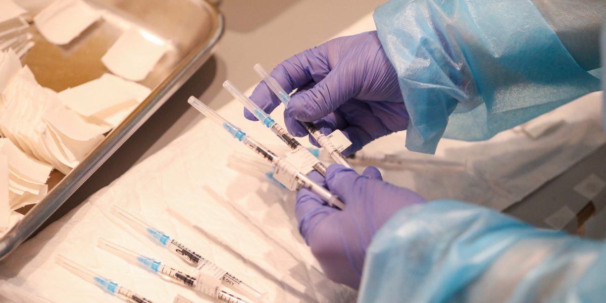 Companies enlist vaccine whisperers to convince skeptical workers to get their jabs
