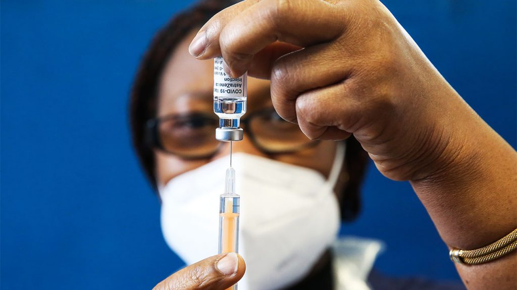 Healthcare worker drawing a shot of vaccine