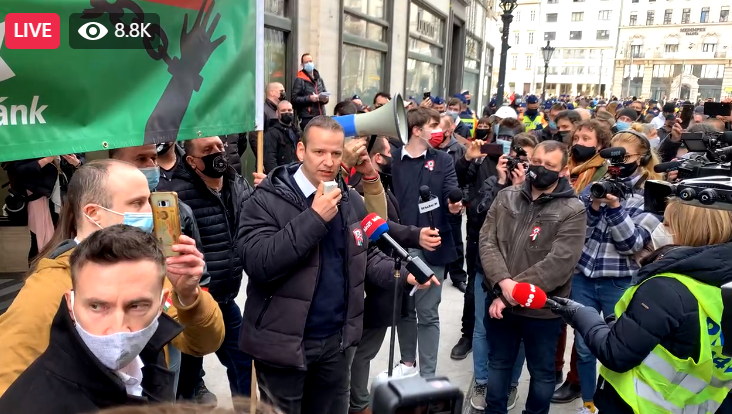 László Toroczkai speaking at the Mi Hazánk Mozgalom (Our Homeland Movement) demonstration on 15th March 2021. Image capture of Telex.hu Facebook live feed.