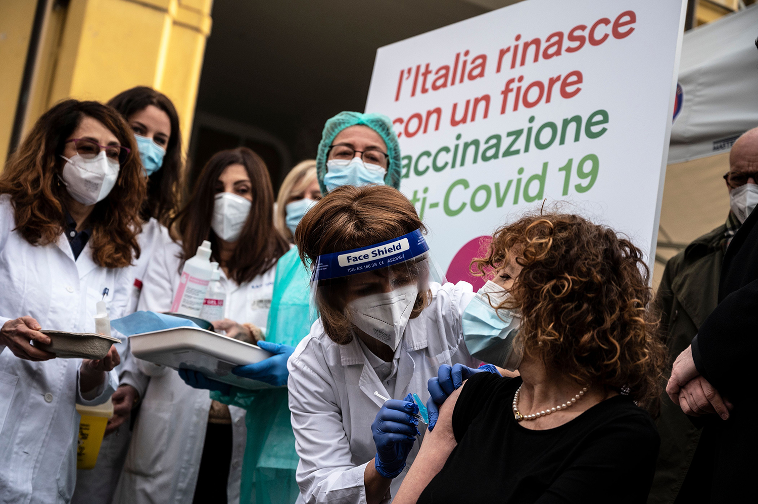 Medical staff members get vaccinated against COVID-19 at the Amedeo di Savoia Hospital in Turin, Northwestern Italy, on Dec. 27, 2020. MARCO BERTORELLO/AFP via Getty Images