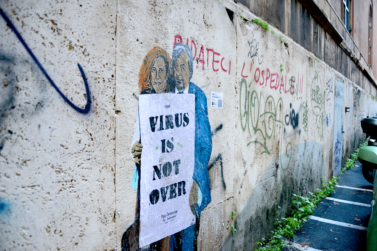 Art titled The Influenzers depicts the virologists Roberto Burioni and Ilaria Capua on a wall in Rome on Dec. 3, 2020.