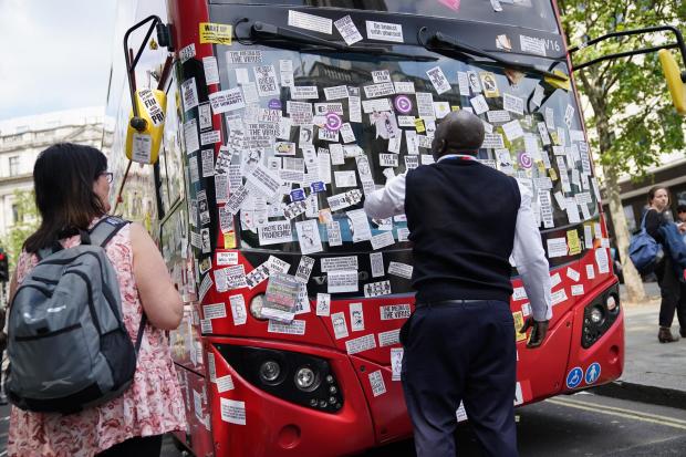 HeraldScotland: A London Bus is covered in anti-vaccine stickers near Trafalgar Square following a anti-vaccine protest in central London.