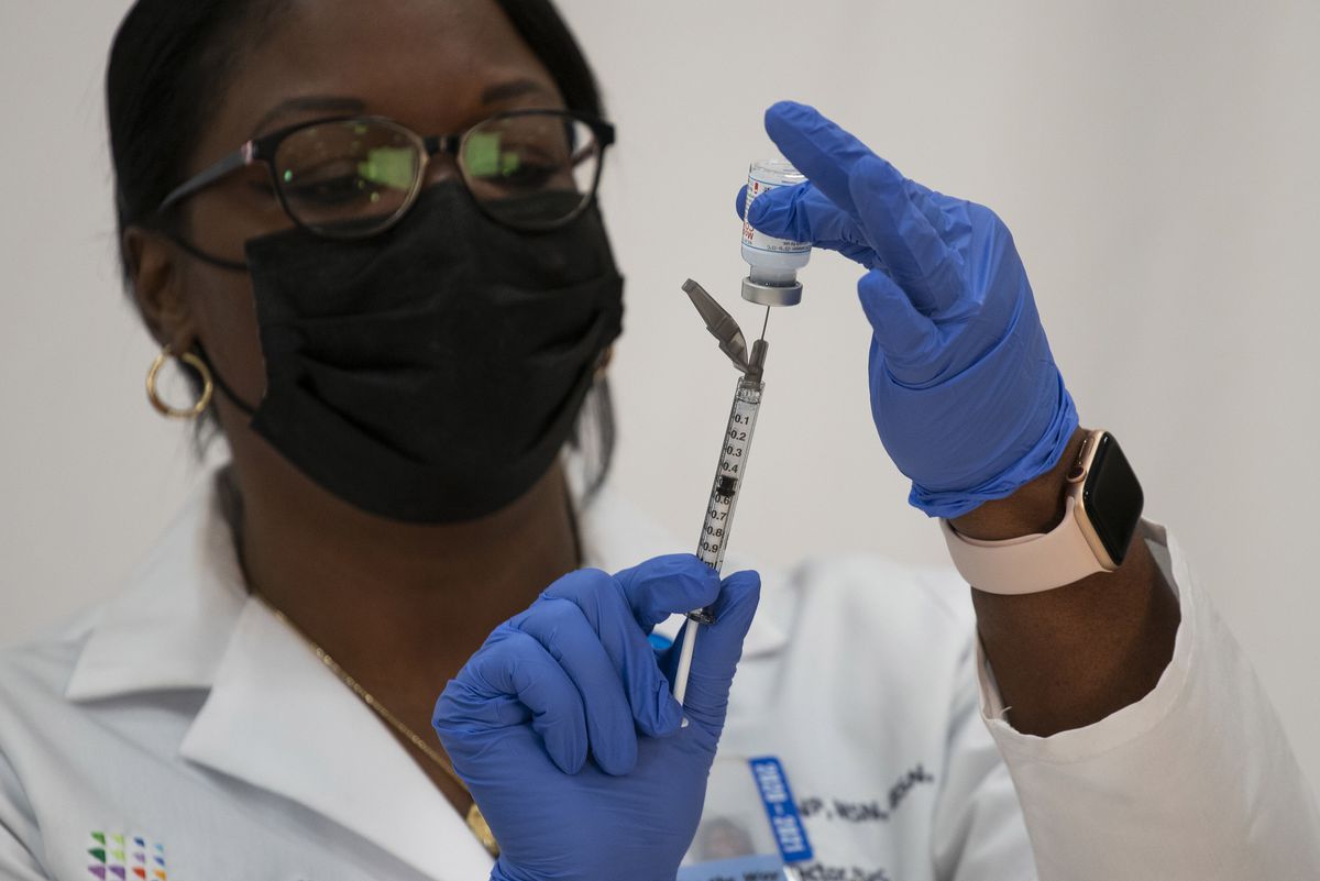 Michelle Chester preparing the Moderna COVID-19 vaccine at Northwell Health’s Long Island Jewish Valley Stream hospital on Dec. 21 in Valley Stream, New York. She administered the first COVID shot in New York.