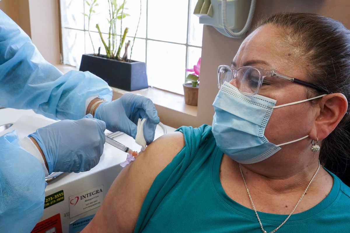 Registered nurse Anna Yadgaro inoculates Juana Mejia with the Moderna COVID-19 vaccine at the Joseph P. Addabbo Family Health Center in Far Rockaway.