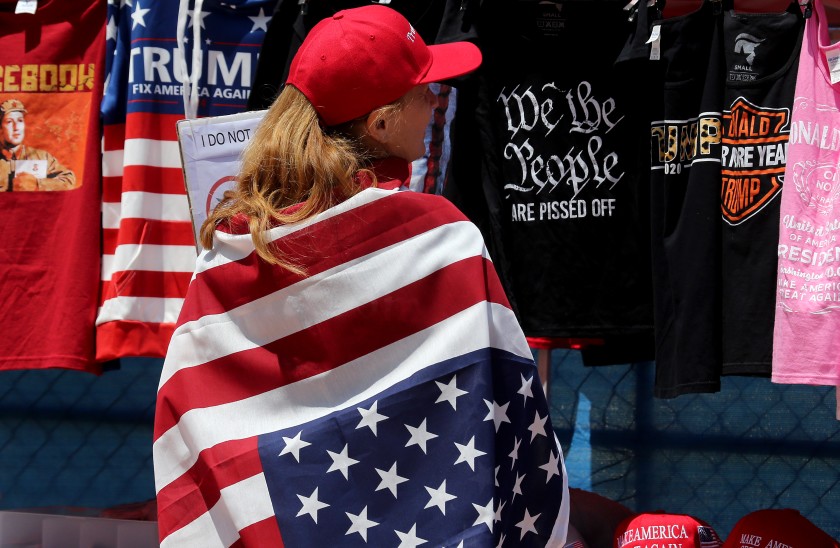 A woman draped in an American flag