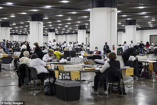 Election workers in Detroit, Michigan, process the ballots on November 4