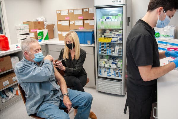 Pharmacist Brittany Marsh administered the Moderna vaccine to Gary McLaughlin in Little Rock, Ark., in March.