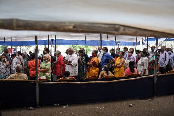 Lining up at a vaccination center in Mumbai in April.