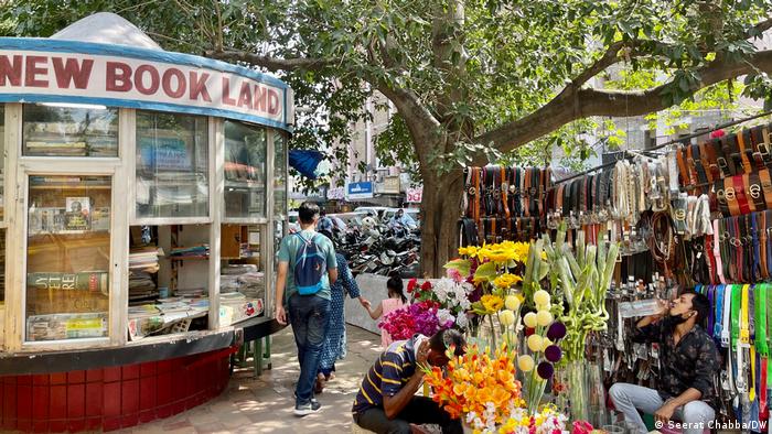 Shoppers and vendors at a local market in Delhi