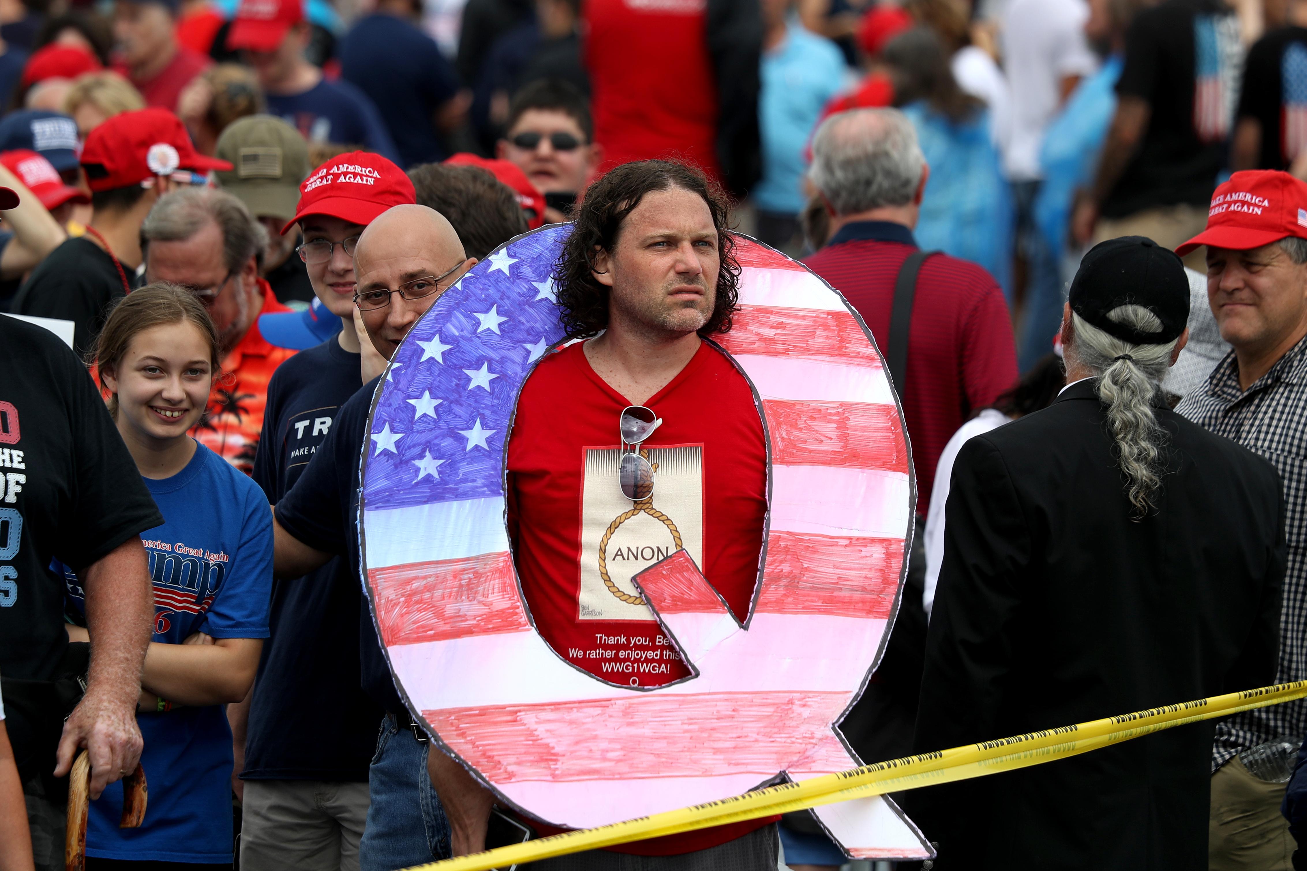 A QAnon enthusiast at a Trump rally