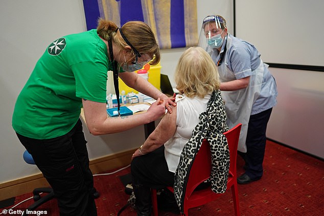 I have long been baffled by the way our Government has seemed to lack the courage of its vaccine-fuelled convictions despite the astonishing success of the roll-out. Pictured: A woman gets her jab at a Newcastle vaccination centre