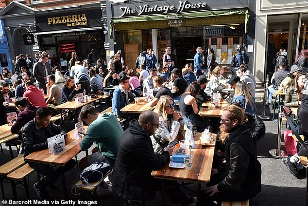 There I was savouring the buzzing atmosphere as I enjoyed a pint in the pub with friends, when it became clear that I needed to correct a misapprehension. All my drinking companions were double vaccinated and seemed to think this made them more or less bulletproof when it came to Covid. Pictured: Diners in Soho, west London