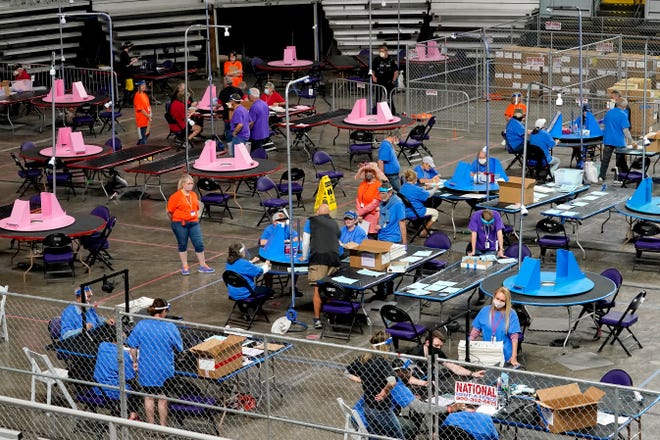 Maricopa County ballots cast in the 2020 general election are examined and recounted by contractors working for Florida-based company, Cyber Ninjas, Thursday, May 6, 2021, at Veterans Memorial Coliseum in Phoenix.