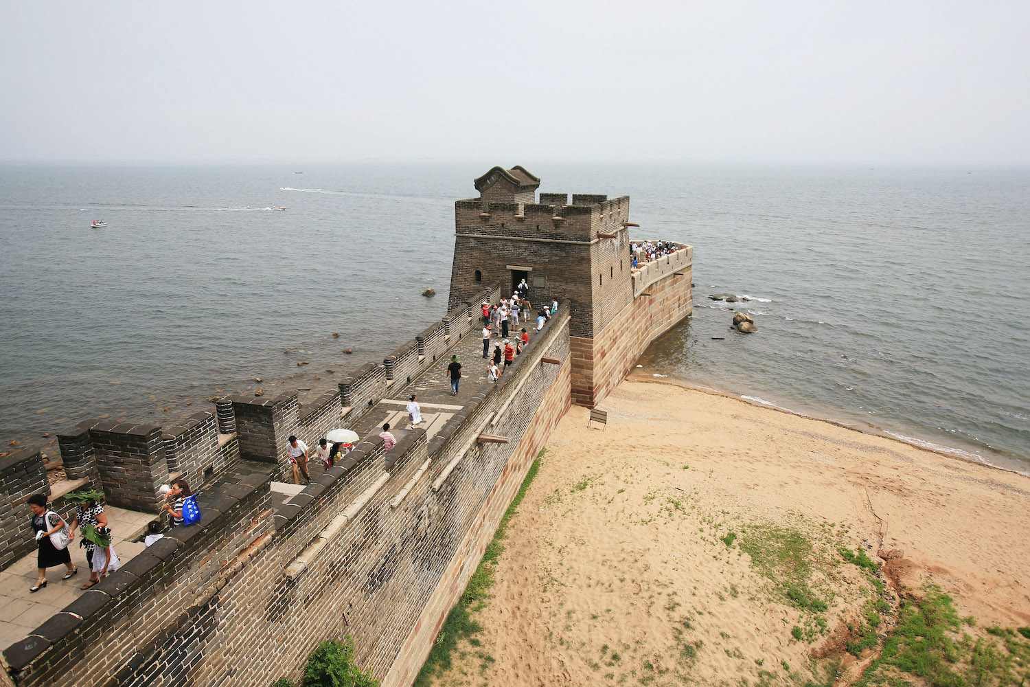 Tourists visit the Old Dragon's Head section of the Great Wall in Qinhuangdao, China, on July 9, 2009.