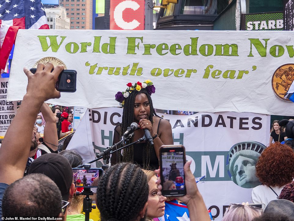 A woman also spoke at the protest and demanded 'truth over fear' while supporters watched and filmed her