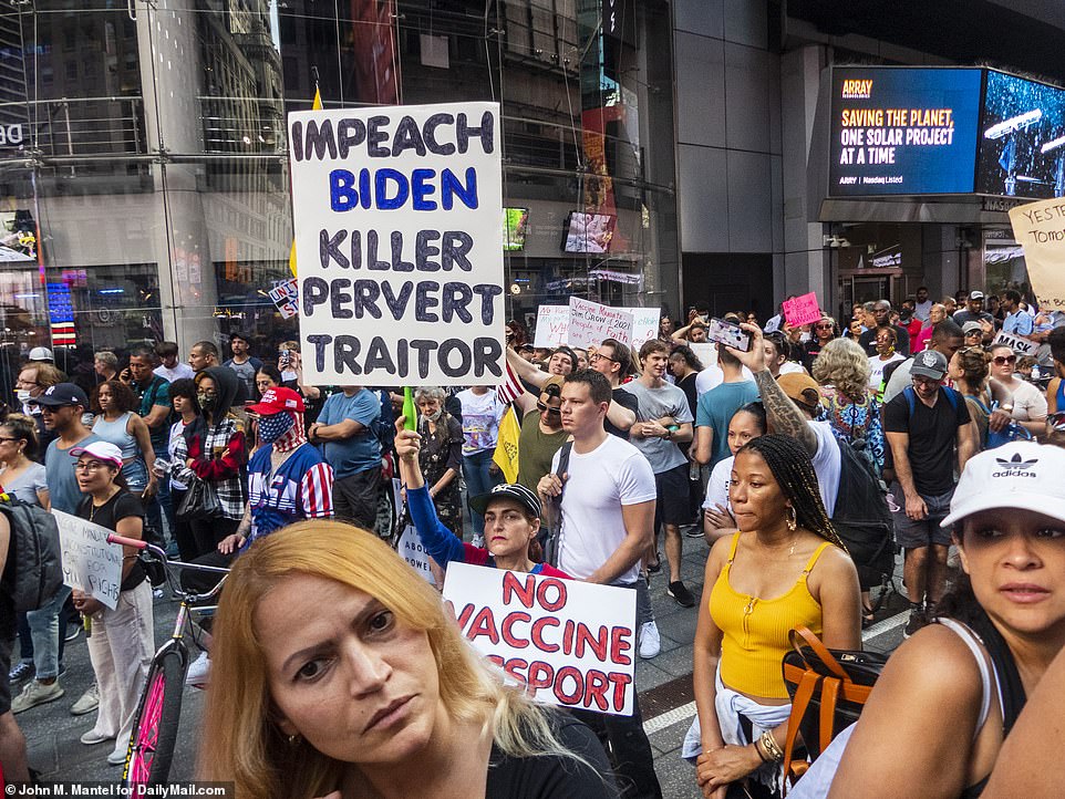 Angered New Yorkers in attendance also protested to impeach Biden, calling him a 'killer, pervert (and) traitor' while some were spotted in Make America Great Again (MAGA) hats and sporting red white and blue clothes