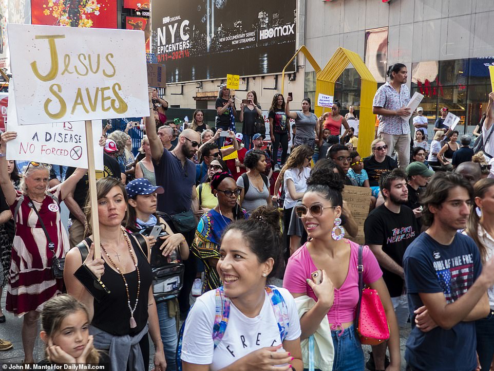 Barely anyone wore masks in the crowd, which stretched for several blocks in Manhattan's Times Square