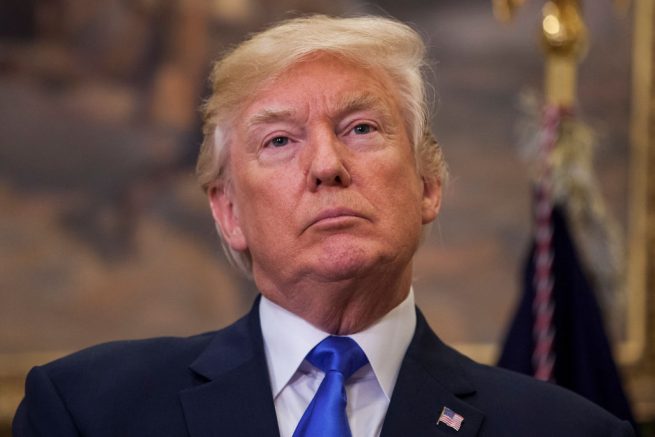 WASHINGTON, DC - AUGUST 2: (AFP OUT) U.S. President Donald Trump attends the announcement of the introduction of the Reforming American Immigration for a Strong Economy (RAISE) Act in the Roosevelt Room at the White House on August 2, 2017 in Washington, DC. The act aims to overhaul U.S. immigration by moving towards a "merit-based" system. (Photo by Zach Gibson - Pool/Getty Images)