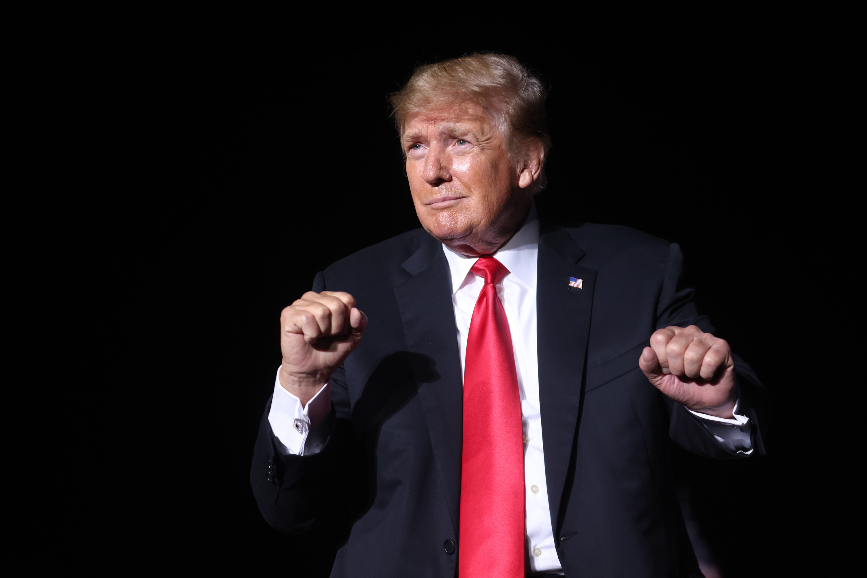 Donald Trump dances at an Iowa rally.