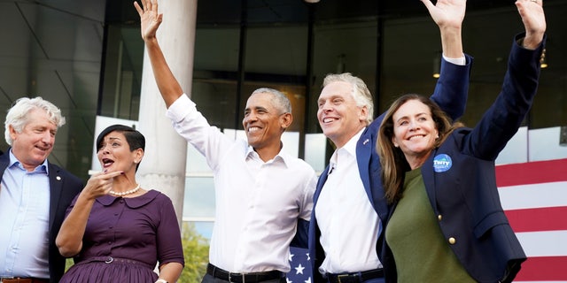 Virginia Attorney General Mark Herring, Lieutenant Governor Candidate and Virginia State Delegate Hala Alaya, former U.S. President Barack Obama and Virginia Democratic gubernatorial candidate Terry McAuliffe and his wife Dorothy McAuliffe gesture during a campaign rally for Virginia Democratic gubernatorial candidate Terry McAuliffe in Richmond, Va., Oct. 23, 2021. REUTERS/Kevin Lamarque