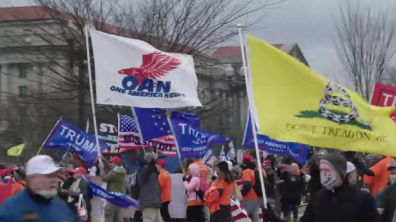 An OAN flag was photographed outside U.S. Capitol during Jan. 6 insurrection.