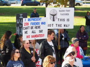 Hundreds of people protested Saturday outside the Capitol to oppose federal mandates for COVID-19 vaccinations. Inside the statehouse, a special legislative committee gathered testimony on alleged government overreach during the pandemic. (Tim Carpenter/Kansas Reflector)