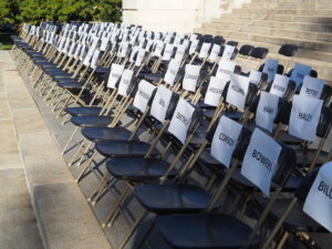 Organizers of an anti-vaccination rally Saturday at the Capitol in Topeka placed chairs on the steps with names of legislators called upon to stop federal COVID-19 mandates. (Tim Carpenter/Kansas Reflector)