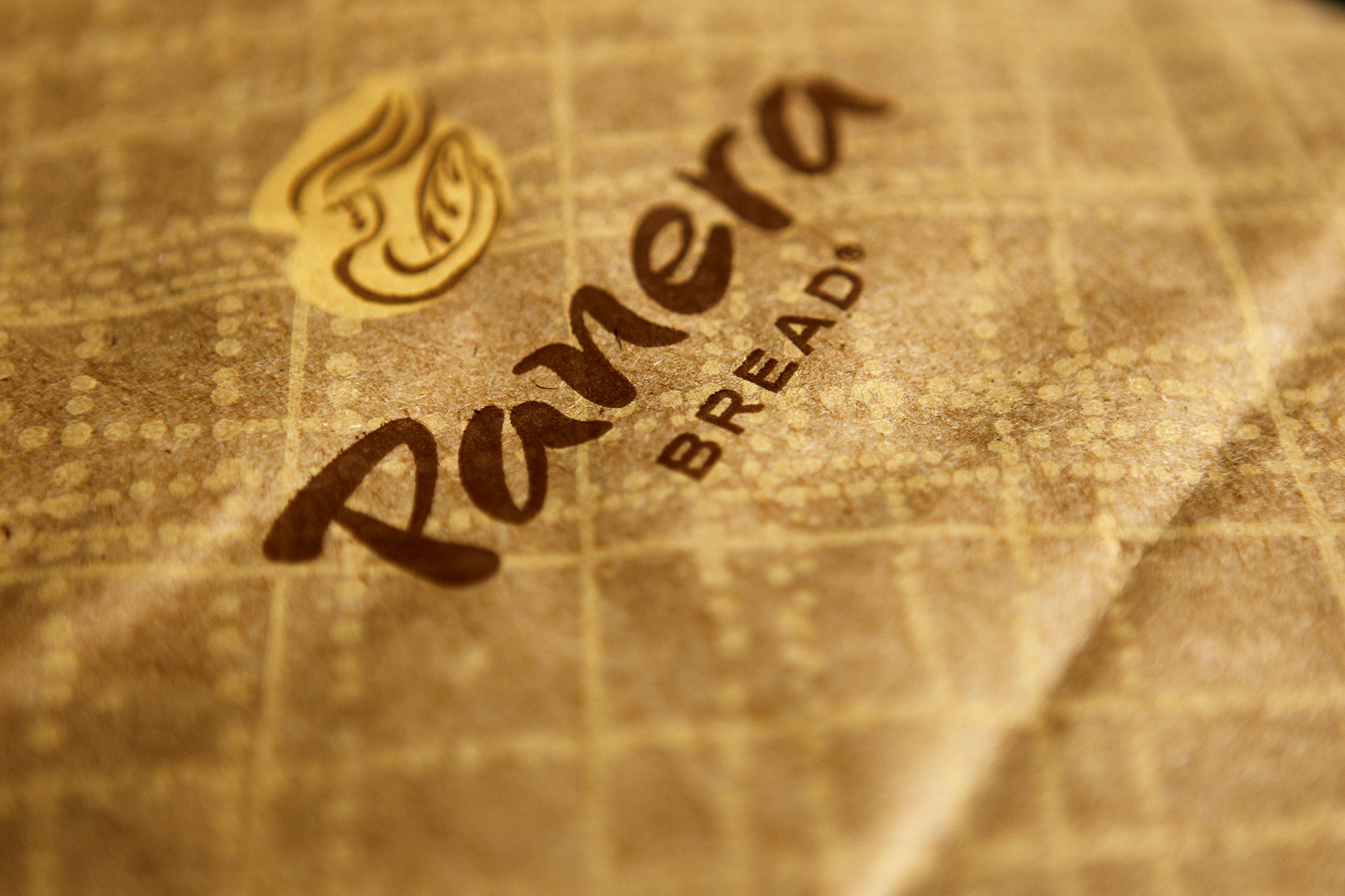 The Panera Bread Co. logo is seen on a napkin displayed for a photograph outside of a restaurant in Torrance, California,