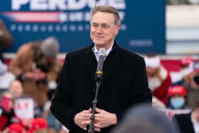 COLUMBUS, GA - DECEMBER 11: U.S. Senator David Perdue speaks at a Defend The Majority campaign event attended by U.S. Vice President Mike Pence on December 17, 2020 in Columbus, Georgia. Sen. David Perdue and Sen. Kelly Loeffler are facing a January 5 runoff election in Georgia. (Photo by Elijah Nouvelage/Getty Images)