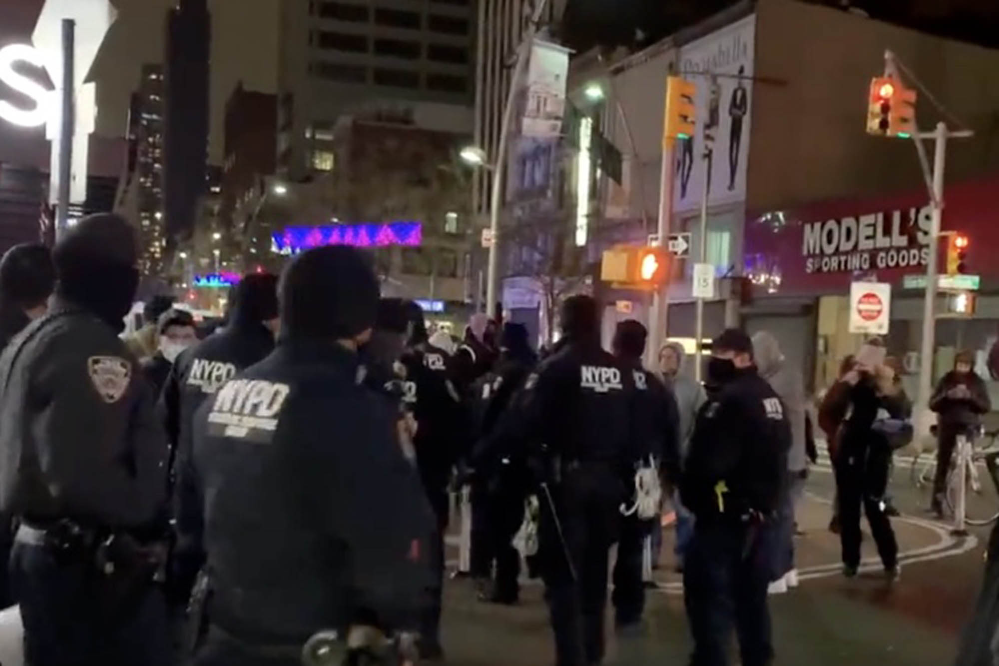 NYPD stands in the street after the incident.