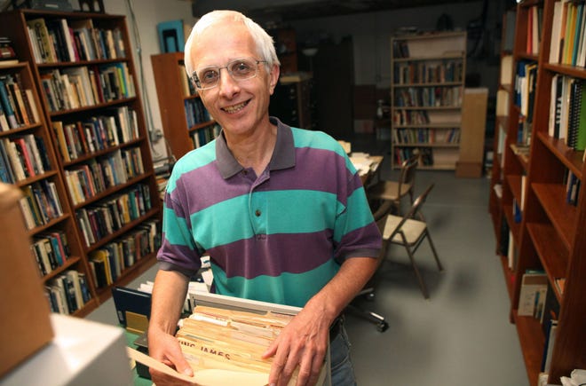 Mark Rodeghier, director of Center for UFO Studies (CUFOS), shows off files in the basement of his house in Norwood in 2013.