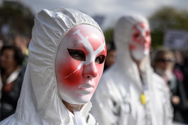 A masked protester at a rally against COVID-19 vaccination mandates and other measures in Geneva in October last year. 