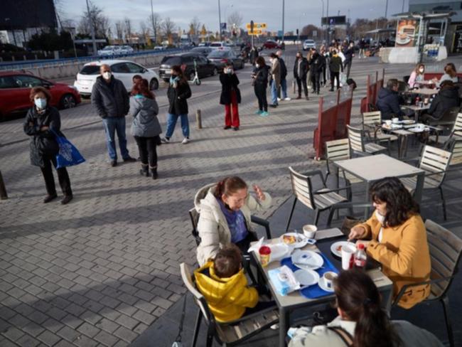 People queue at La Paz Hospital to undergo a Covid-19 test in Madrid.