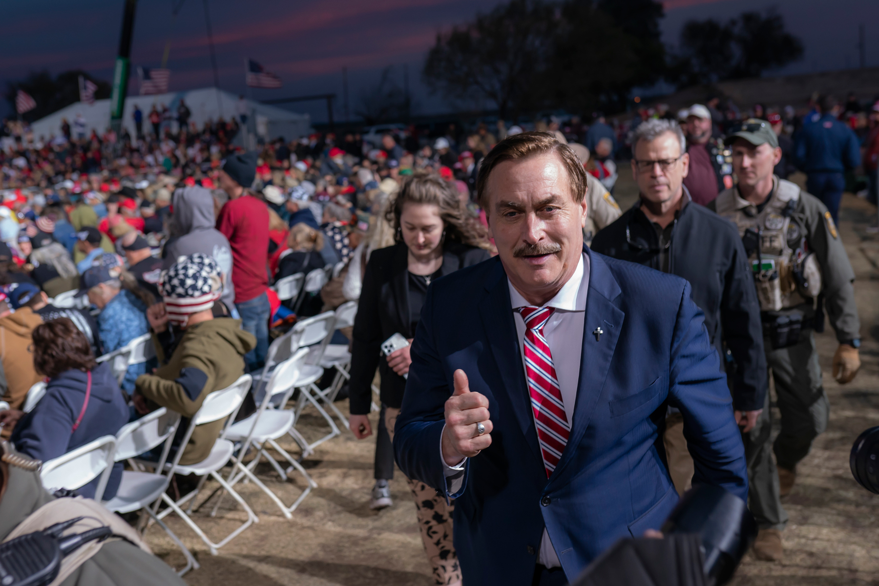 Mike Lindell, CEO of My Pillow, walks past a crowd of supporters during a rally for former President Donald Trump on Saturday, Jan. 15, 2022, in Florence, Az. (AP Photo/Nathan Howard)