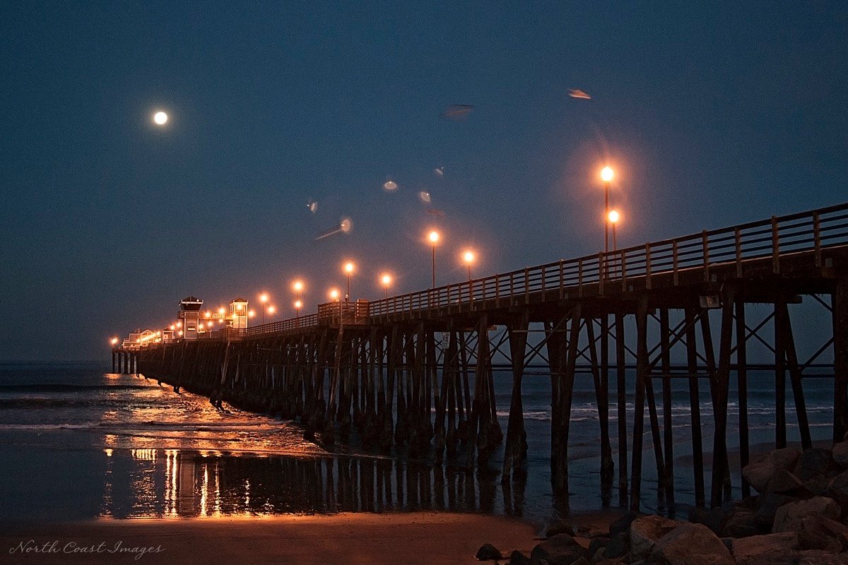 UFO or UAP: Carlsbad photographer Ann Patterson's photo of a strange object near Oceanside pier. Patterson said the image has not been altered but the image contains a watermark from her photography business. The Coast News has not independently verified whether the photo was changed. Photo courtesy of Ann Patterson