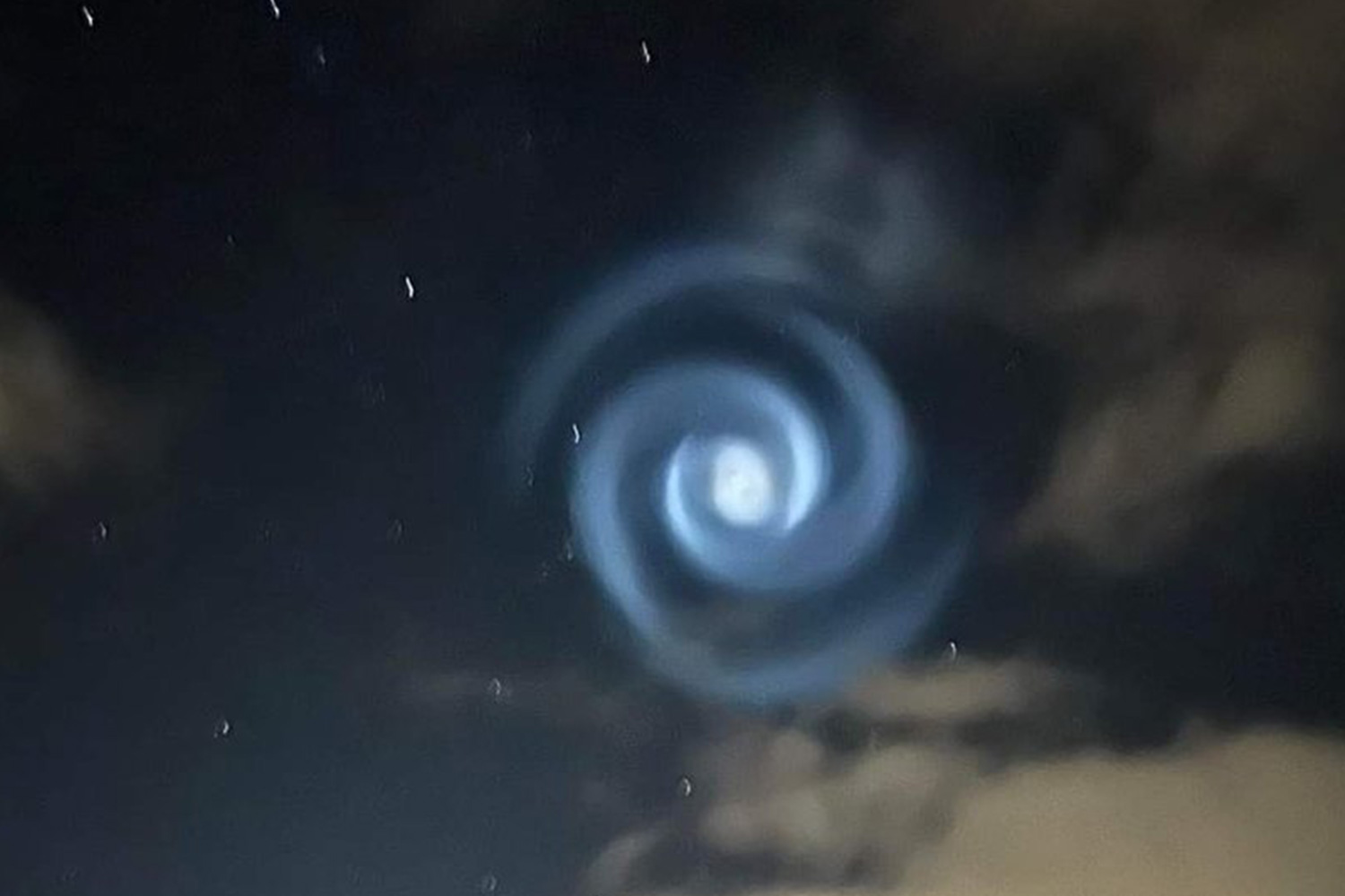 Mystery as eerie twisting spiral appears in sky sparking alien fears