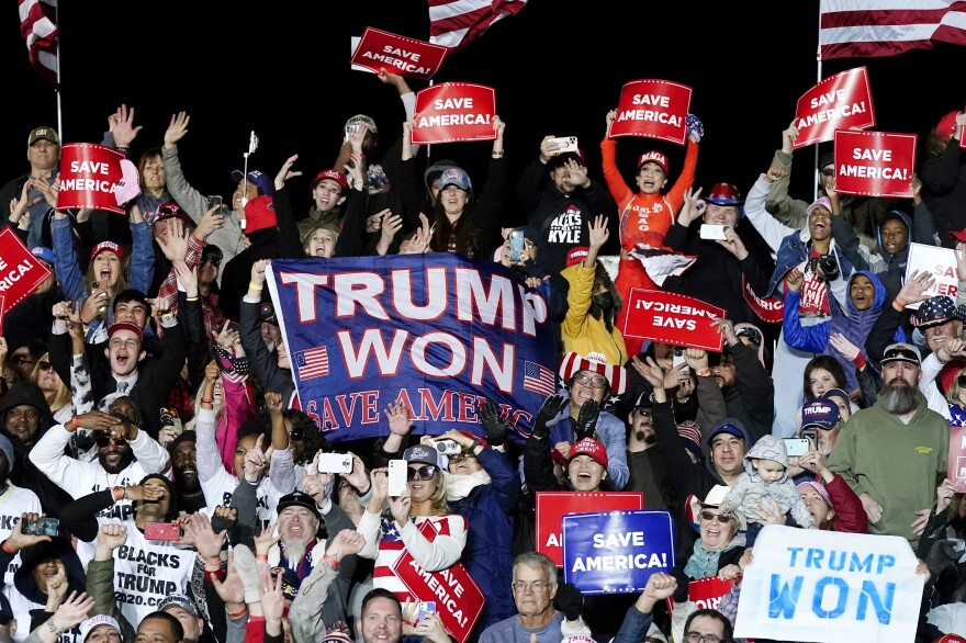 Supporters of former President Donald Trump cheer as he speaks at a Save America Rally in Florence, Ariz., on Jan. 15. Mike Lindell and three Arizona lawmakers — Debbie Lesko, Andy Biggs and Paul Gosar — also attended the event.