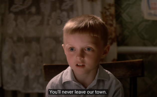 Film still from 'Gorod Zero' featuring a child telling protagonist, Alexei Varakin, he cannot leave the town.