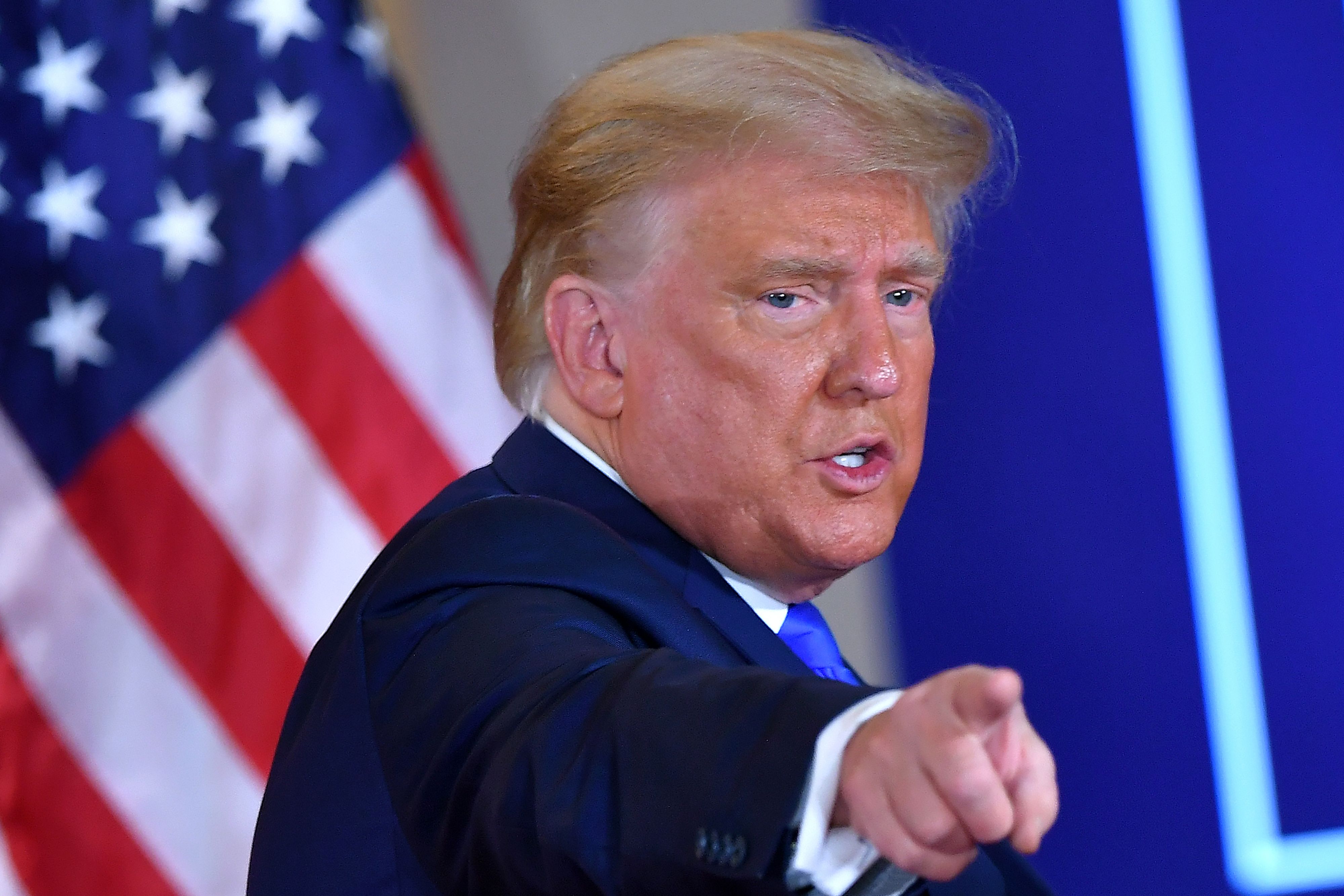 TOPSHOT - US President Donald Trump gestures after speaking during election night in the East Room of the White House in Washington, DC, early on November 4, 2020. (Photo by MANDEL NGAN / AFP) (Photo by MANDEL NGAN/AFP via Getty Images)