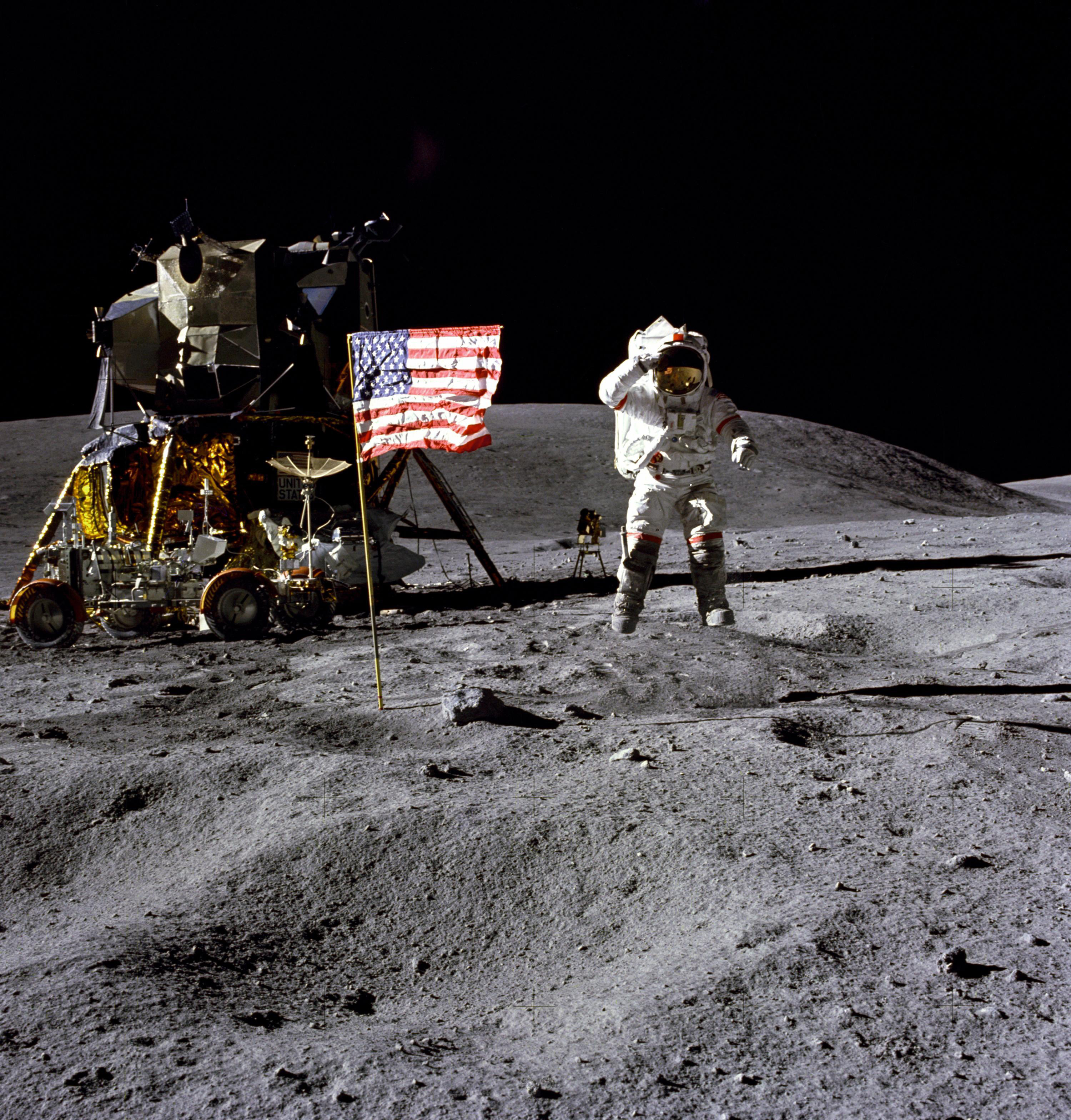 In this April 1972 photo made available by NASA, John Young salutes the U.S. flag at the Descartes landing site.