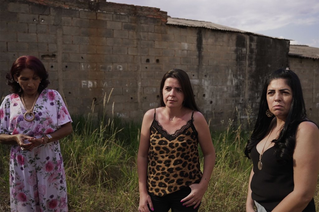 Kátia Xavier (from left), Valquíria Silva and Liliane Silva return to the scene where they claimed to see a “sad, shrunken” creature in Brazil in 1996.